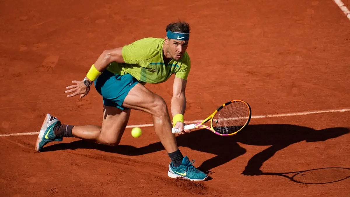 Rafael Nadal returns the ball to Botic van de Zandschulp during their French Open 2022 tie.
