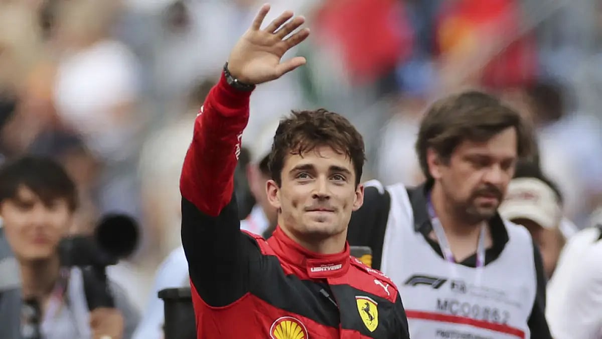 Charles Leclerc thumbs up to spectators after claiming the pole position for Monaco GP.