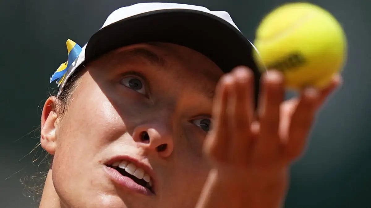Poland's Iga Swiatek serves to Montenegro's Danka Kovinic during their third round match at French Open.