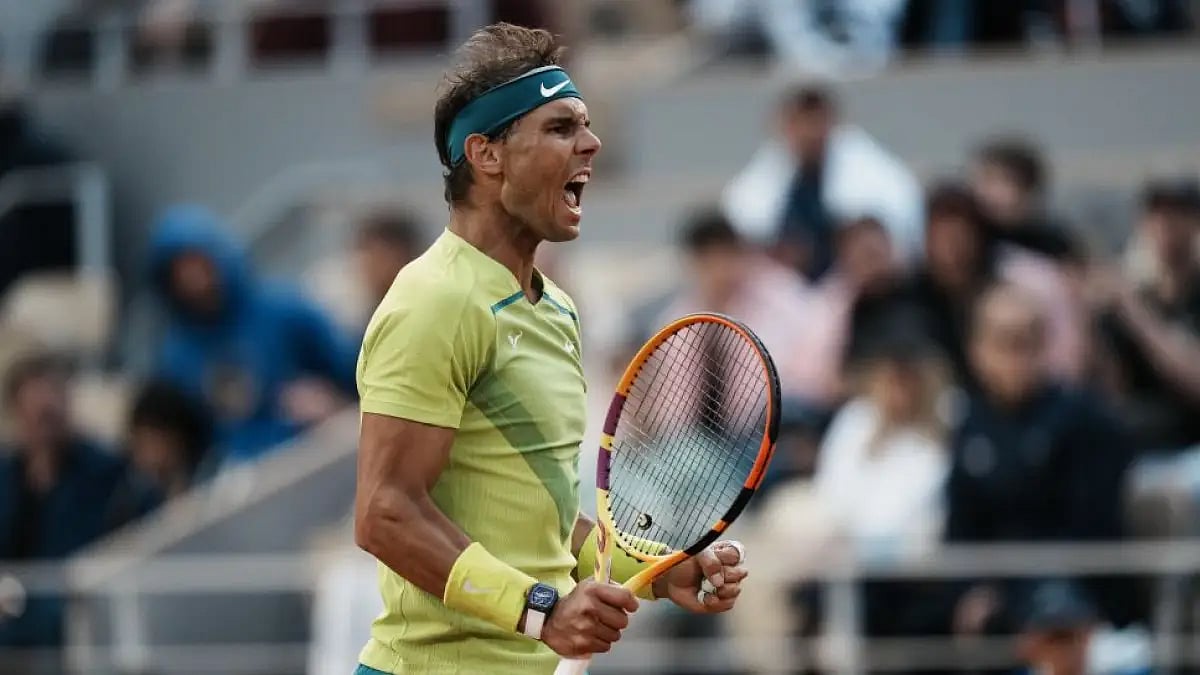 Rafael Nadal clenches his fist after scoring a point against Felix Auger-Aliassime at French Open 20