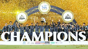 Gujarat Titans players celebrate with the IPL trophy after beating Rajasthan Royals in 2022 final, Ahmedabad, May 29. Photo - IPL