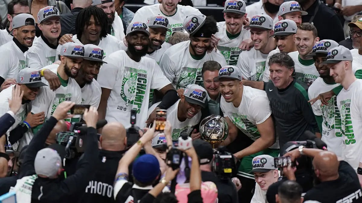 Boston Celtics celebrate after defeating Miami Heat in Game 7 of the NBA Eastern Conference finals play-off series, May 29, 2022, in Miami.