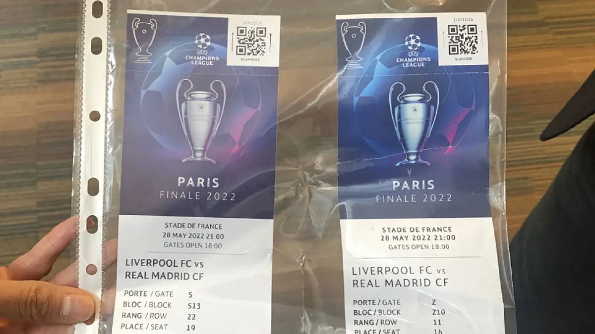 A real, left, and a fake ticket for the Champions League final are displayed at a press conference in Paris, May 30, 2022.