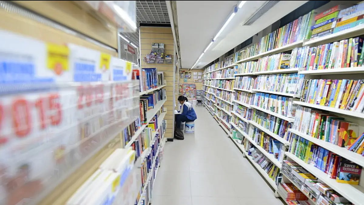 A person reading inside a library. 