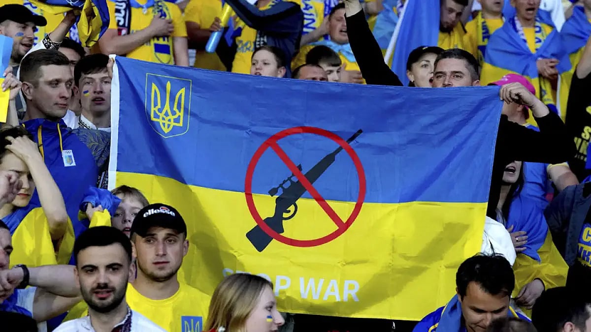 Fans hold up an anti-war banner during Scotland vs Ukraine, FIFA World Cup 2022 qualifying play-off match at Hampden Park, Glasgow, June 1, 2022.