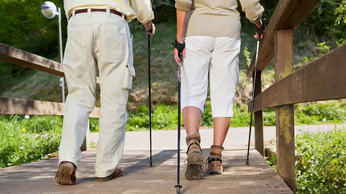 People can cross the Rio del Media bridge in La Cumbrecita, Argentina, by walking