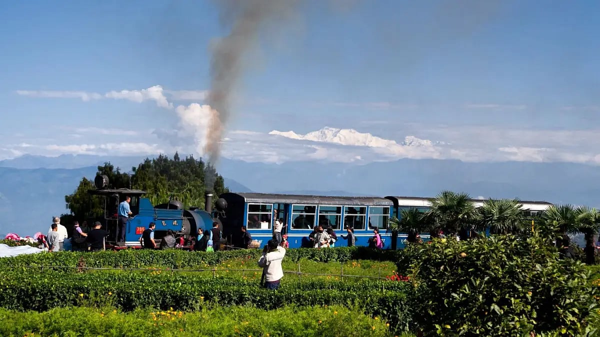 A file photo from 2011 shows the toy train at Batasia Loop with Kanchenjunga in the background 