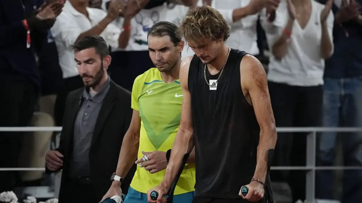 Rafael Nadal walks alongside Alexander Zverev who retired with an ankle injury in the semifinal matc