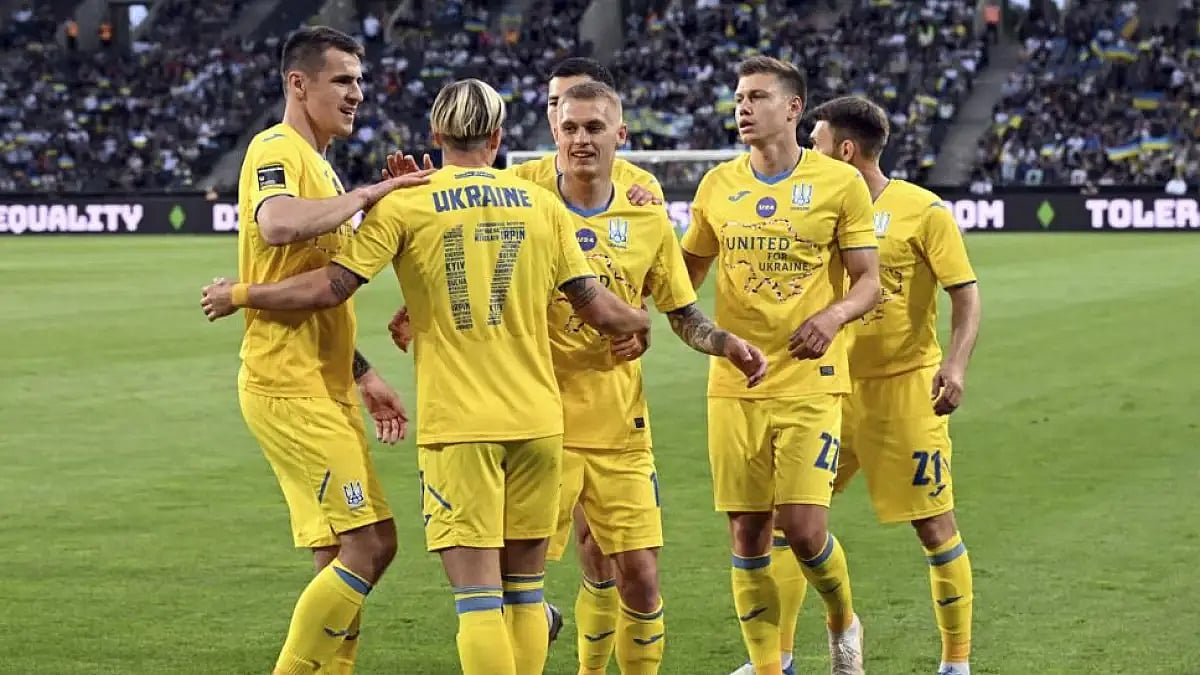 Ukraine national football team players celebrate a goal during their match against Borussia Moenchen