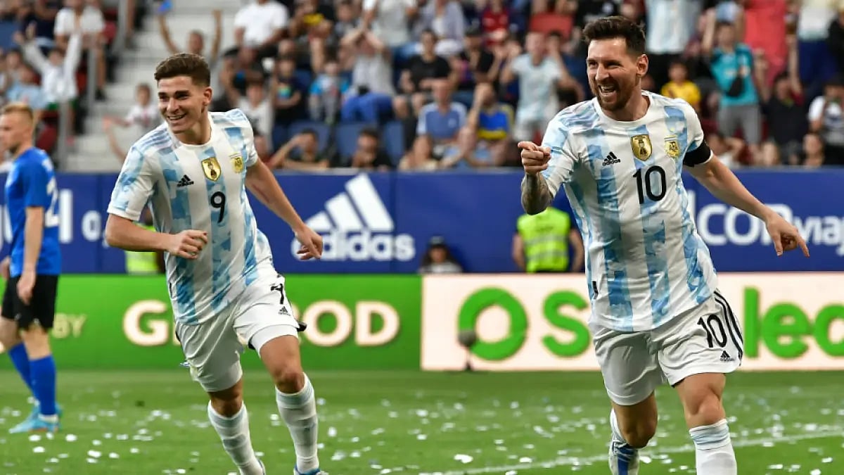 Lionel Messi (R) celebrates after scoring one of his five goals against Estonia. 