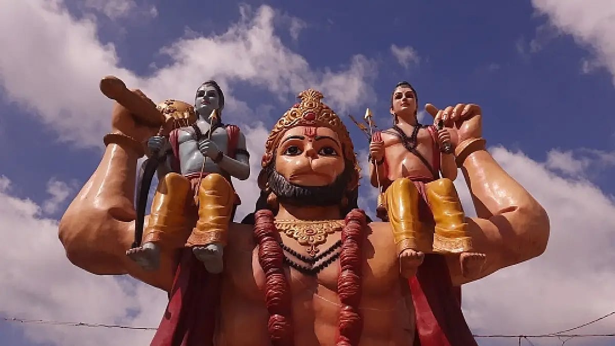 A sculpture of Lord Hanumana carrying Lord Rama and Lakshmana on his shoulders 