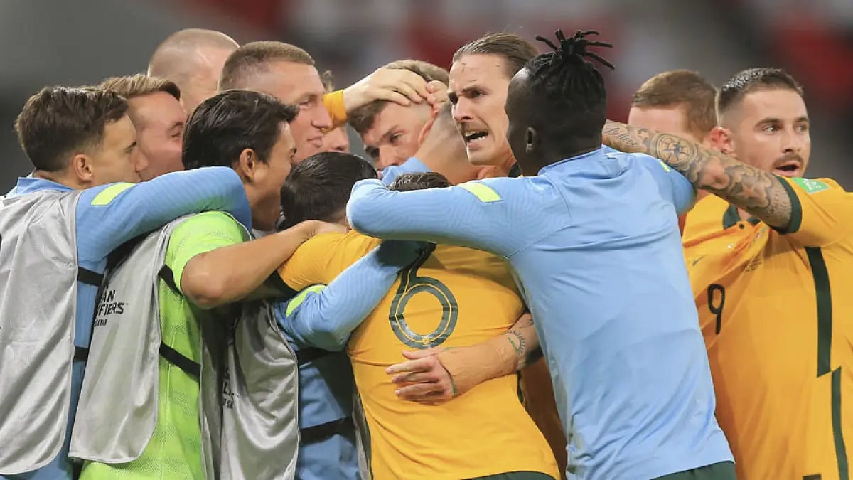 Australian players celebrate after beating UAE in their Asian qualifying playoff in Al Rayyan, Qatar, June 7 2022.