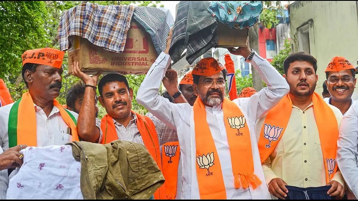 BJP MLC Narayan Swamy and party members collect shorts in Bengaluru on Tuesday. 