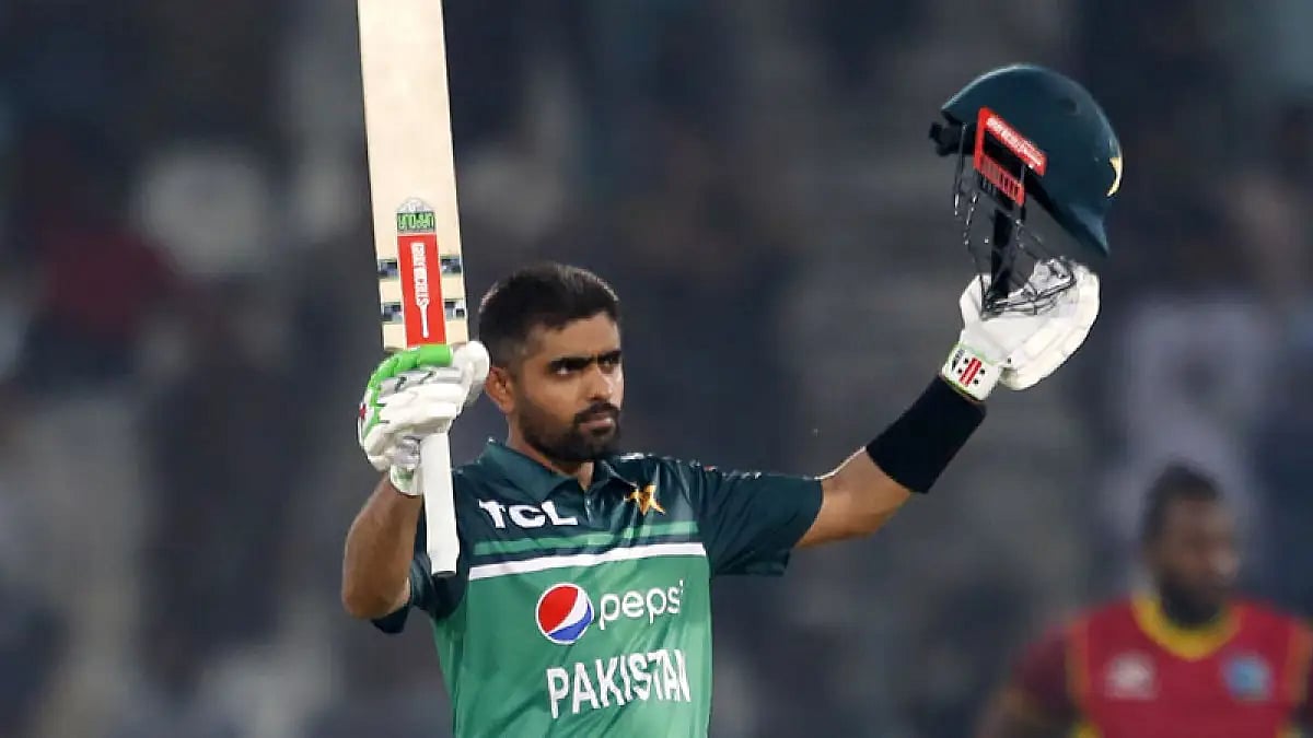 Pakistan's Babar Azam celebrates after scoring a century during the ODI cricket match against West Indies in Multan, June 8, 2022.