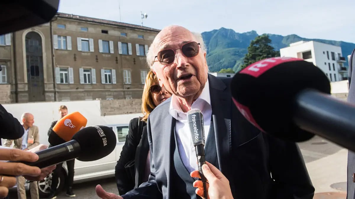 Former FIFA president Sepp Blatter is surrounded by the media as he leaves the Swiss Federal Criminal Court in Bellinzona, Switzerland, June 8, 2022.