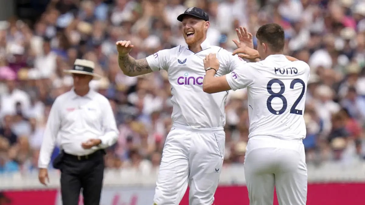 England's Matthew Potts and Ben Stokes celebrate the wicket of New Zealand's Kane Williamson on Day 2 of the Lord's Test.