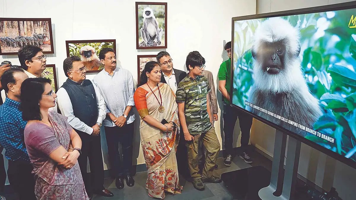 Dignitaries on the inaugural day watching the photographs and wildlife movie of Amoghavarsham at Chi