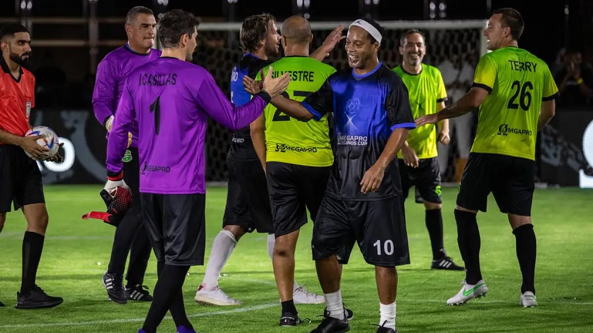 Snapped: All is Fair in Love and Football - John Terry looks content as Ronaldinho and Casillas embrace each other after the first edition of the OmegaPro Legends Cup.