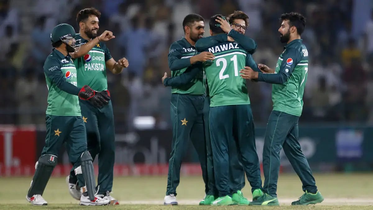 Pakistan's Mohammad Nawaz, center, celebrates with teammates the dismissal of West Indies' Rovman Powell.