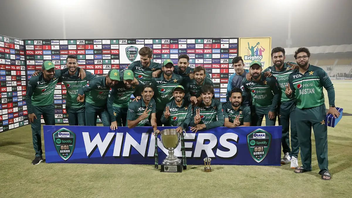 Pakistan players pose with the ODI series trophy after the end of third ODI against West Indies in Multan, June 12, 2022.