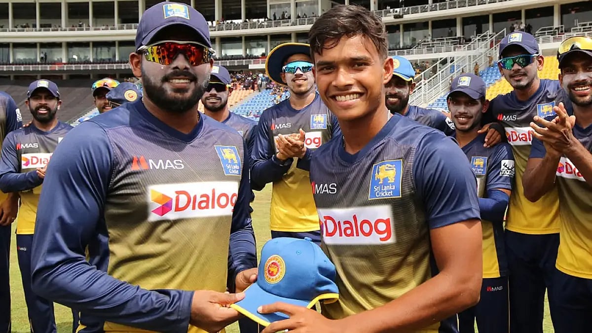 Debutant Dunith Wellalage receives his ODI cap from Wanindu Hasaranga.
