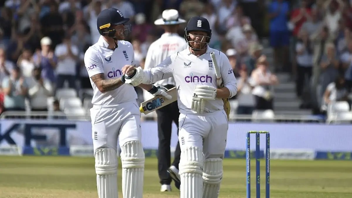 Jonny Bairstow (right) is congratulated by Ben Stokes as he walks off the field after losing his wic