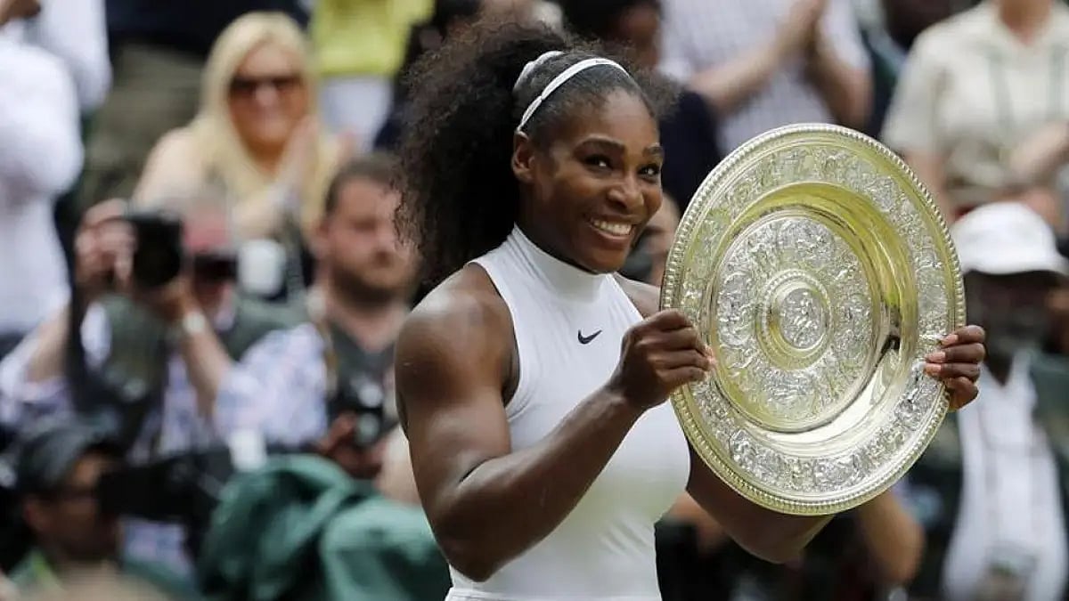 File Photo: Serena Williams holds her trophy after winning the women's singles final at Wimbledon 20