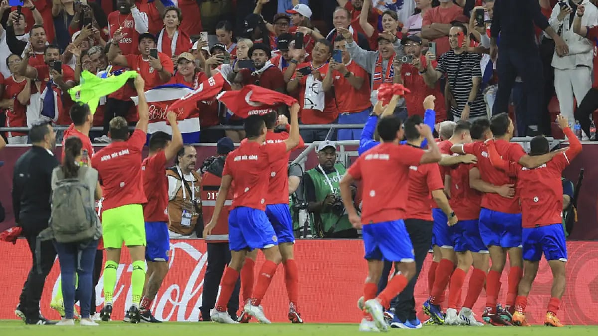 Costa Rica players celebrate after the World Cup 2022 qualifying play-off win against New Zealand in Al Rayyan, Qatar, June 14, 2022.