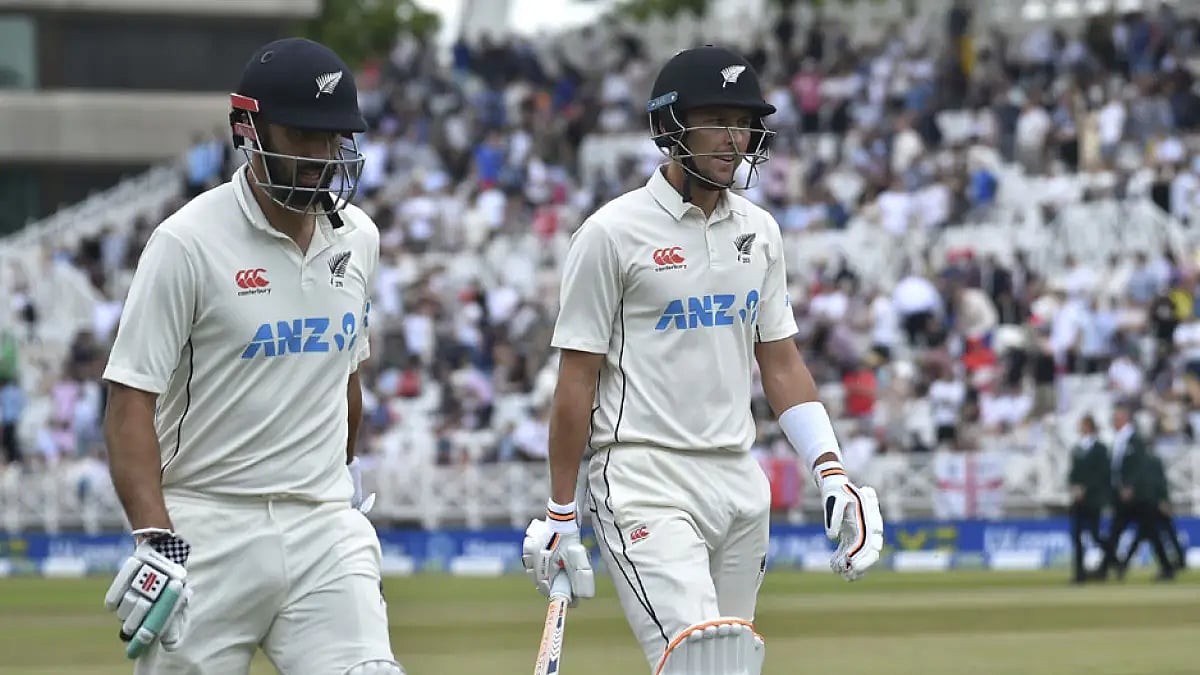 New Zealand's Daryl Mitchell, left, and Trent Boult walk off the field at the end of their innings during the fifth day of the second Test against England at Trent Bridge.