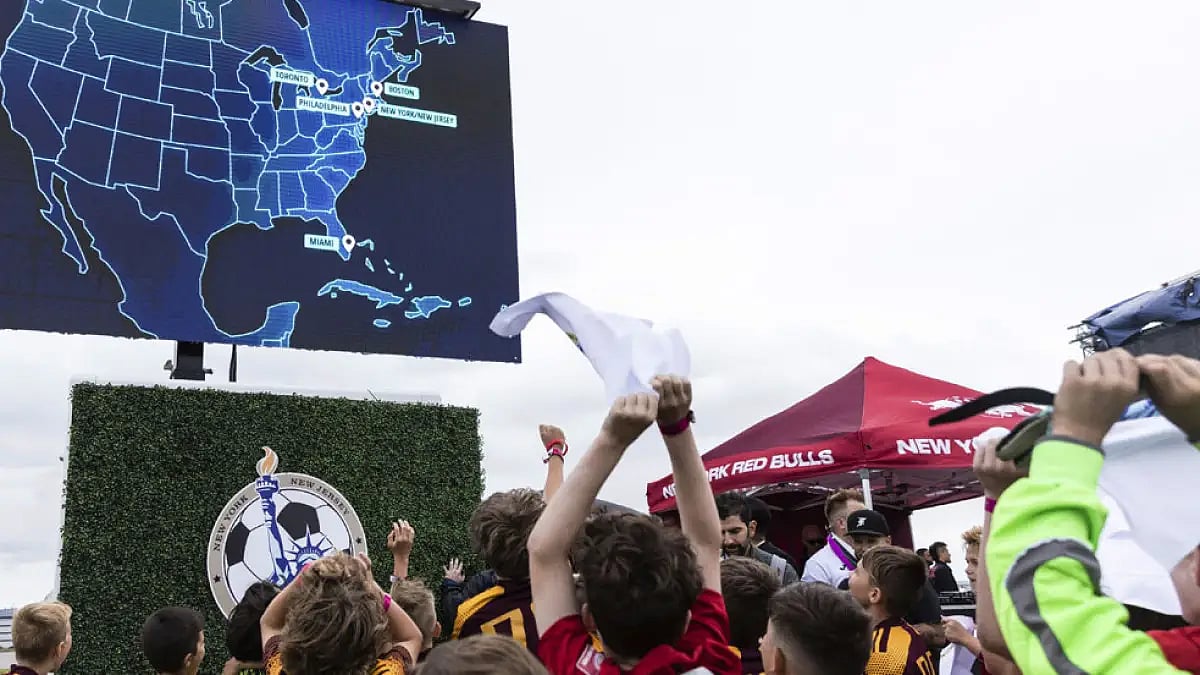 Photo: AP : Children react to the announcement that East Rutherford, N.J., will be a FIFA World Cup 2026 host city.