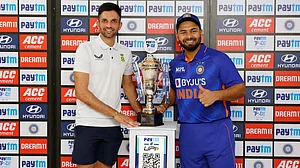 Keshav Maharaj and Rishabh Pant pose with the trophy after the T20 series ended in 2-2 draw.