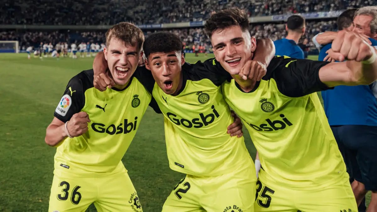 Girona players celebrate after securing La Liga promotion on Sunday. 