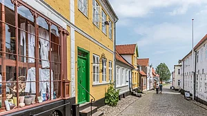 A couple walking along a picturesque lane in the island 