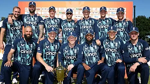 England cricketers pose with the trophy after beating the Netherlands in Amstelveen on June 23, 2022.