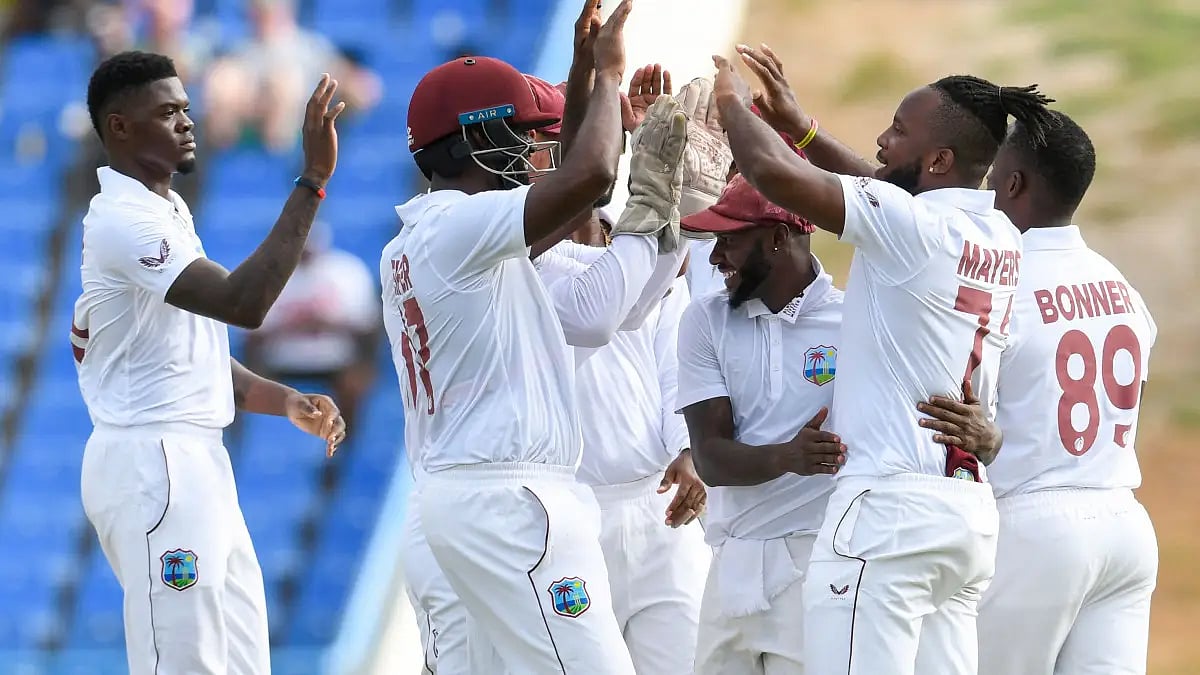 West Indies players celebrate the fall of a Bangladesh wicket on Day 1 of the second Test.  