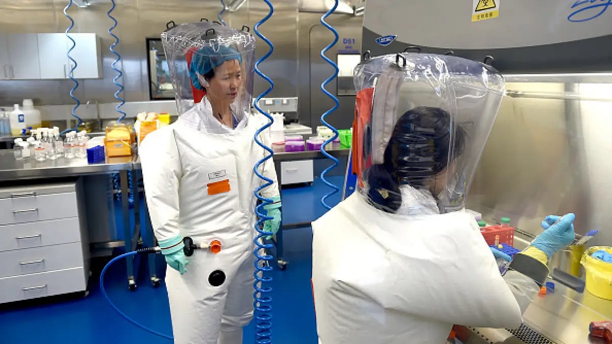 Virologist Shi Zheng-li with a colleague in the a lab of Wuhan Institute of Virology (WIV) in China