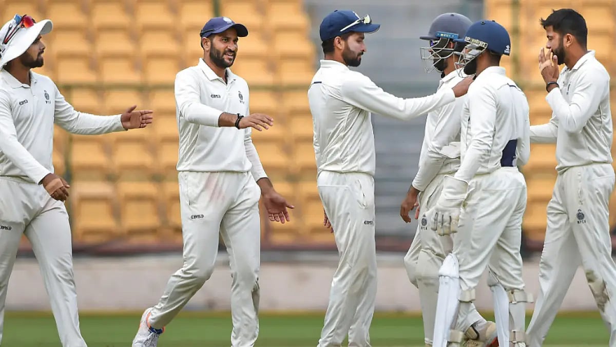 Madhya Pradesh players celebrate the fall of a Mumbai wicket in Ranji Trophy final.   