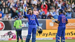 Deepak Hooda raises his bat after his maiden T20 ton against Ireland on Tuesday.