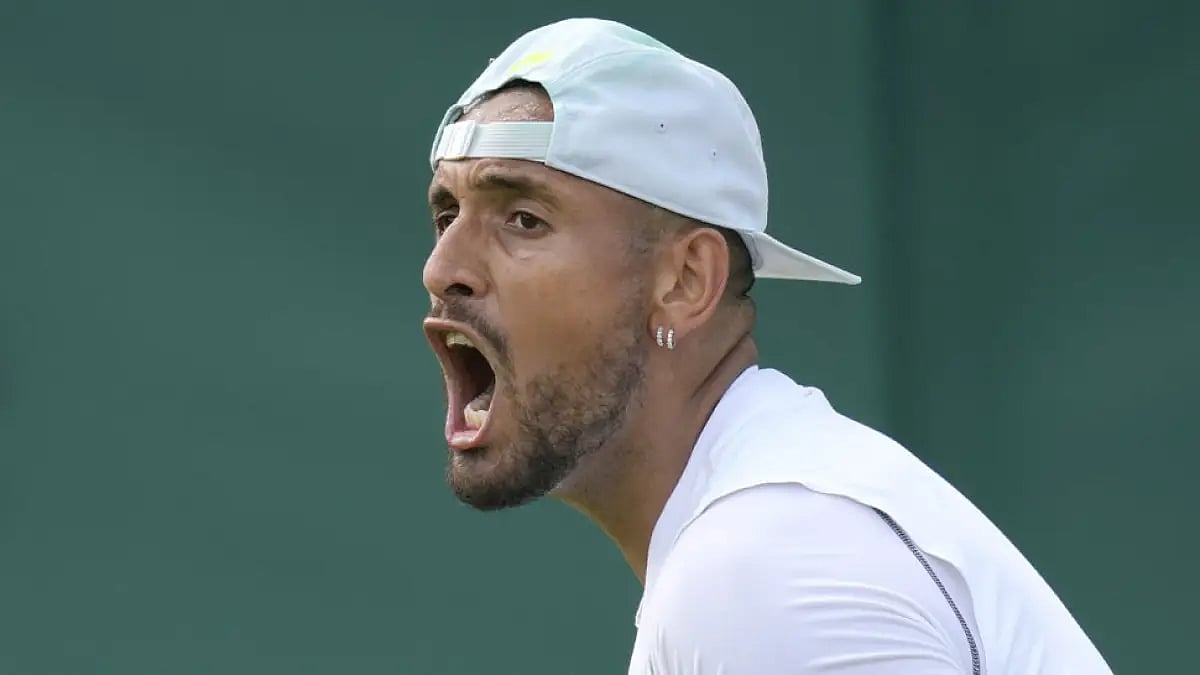 Nick Kyrgios in action against Paul Jubb on day two of Wimbledon 2022.