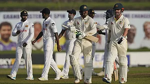 Players walk back at the end of Day 1's play of first Test between Sri Lanka and Australia in Galle.