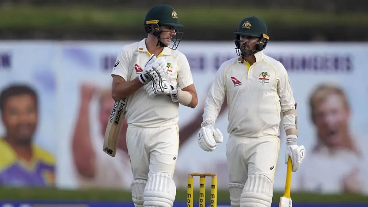Pat Cummins and Nathan Lyon walk off after third day's play of first SL vs AUS Test in Galle.