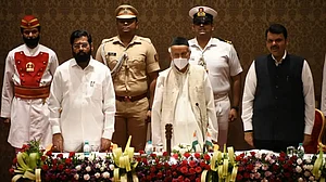 Governor Bhagat Singh Koshari administering the oath of office to Eknath Shinde and Deputy Chief Min