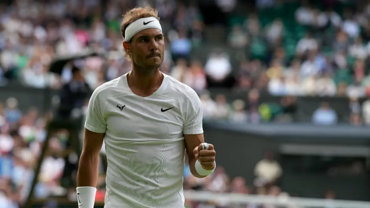 Rafael Nadal celebrates a point against Lorenzo Sonego during Wimbledon 2022 third round match.