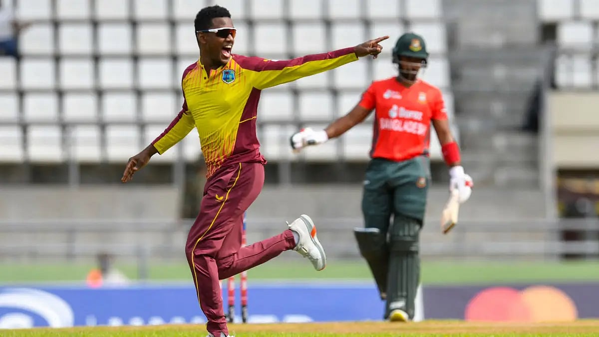 Akeal Hosein celebrates after taking a Bangladesh wicket in the second T20 on Sunday. 
