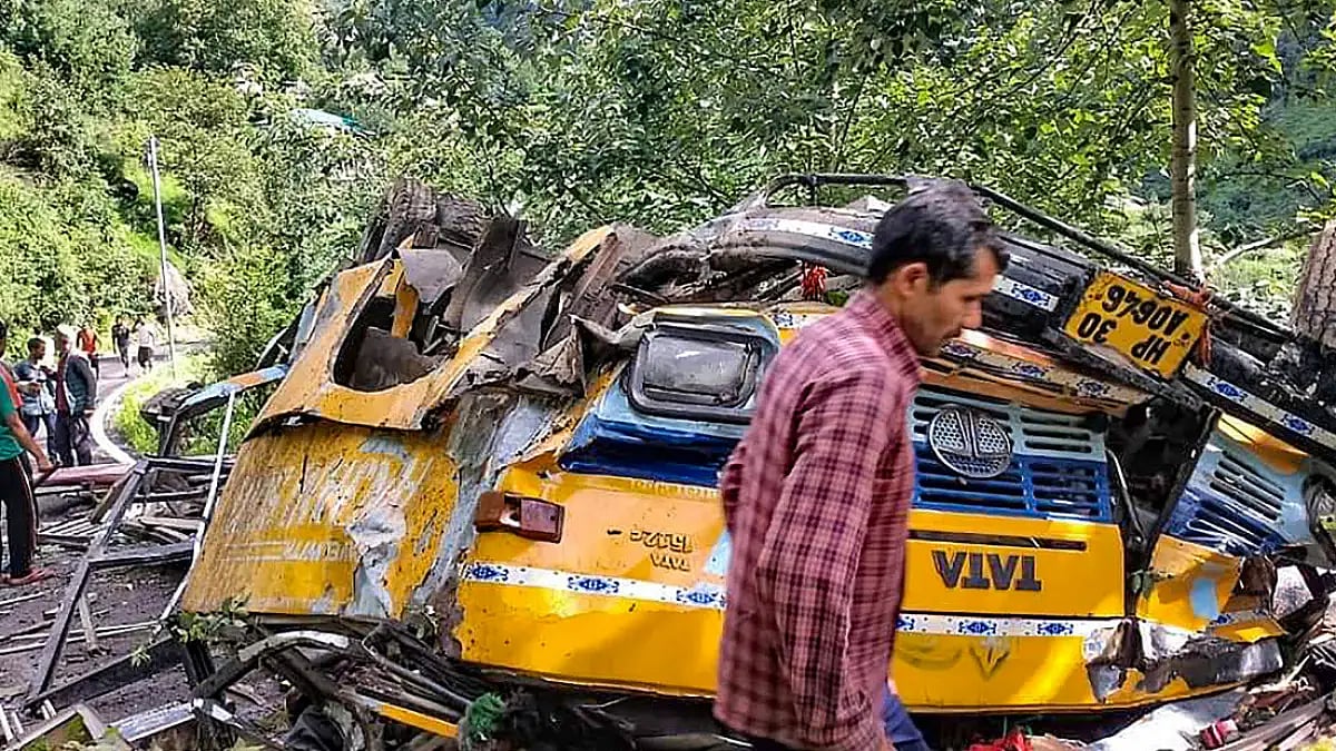 Wreckage of a bus after it fell into a gorge near Jangla village, in Kullu district