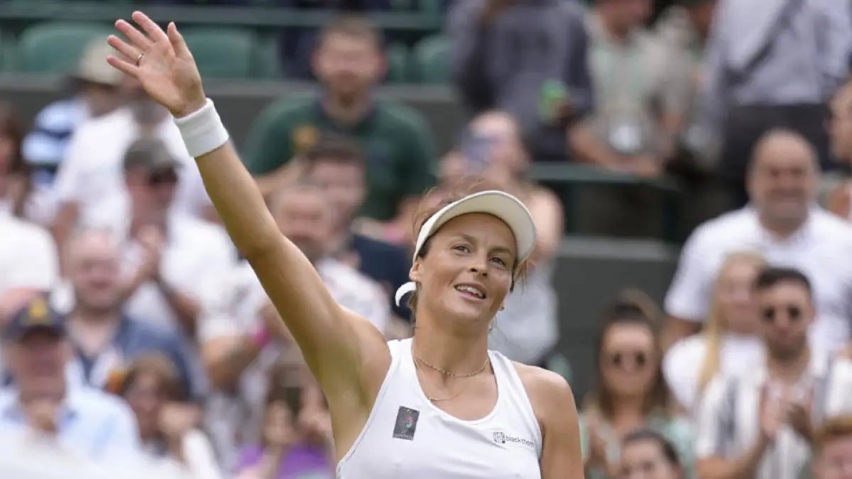 Tatjana Maria celebrates defeating Jule Niemeier in their women's singles quarterfinal match at Wimb