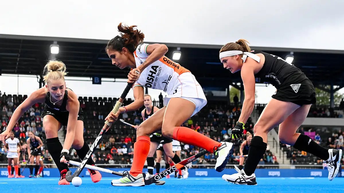 Action between India (in whites) and New Zealand in their FIH Hockey Women's World Cup 2022 tie.