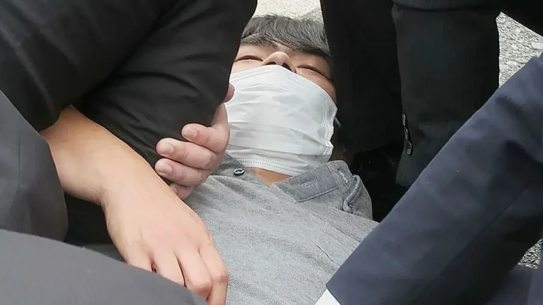 Tetsuya Yamagami, the suspect of killing Shinzo Abe, is detained in this photo - null