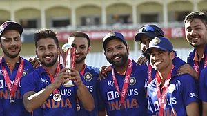 India players celebrate with the trophy after winning the T20I series against England.