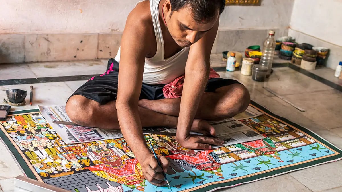 A craftsperson creates a pattachitra painting in Raghurajpur. This art for of Odisha is said to date
